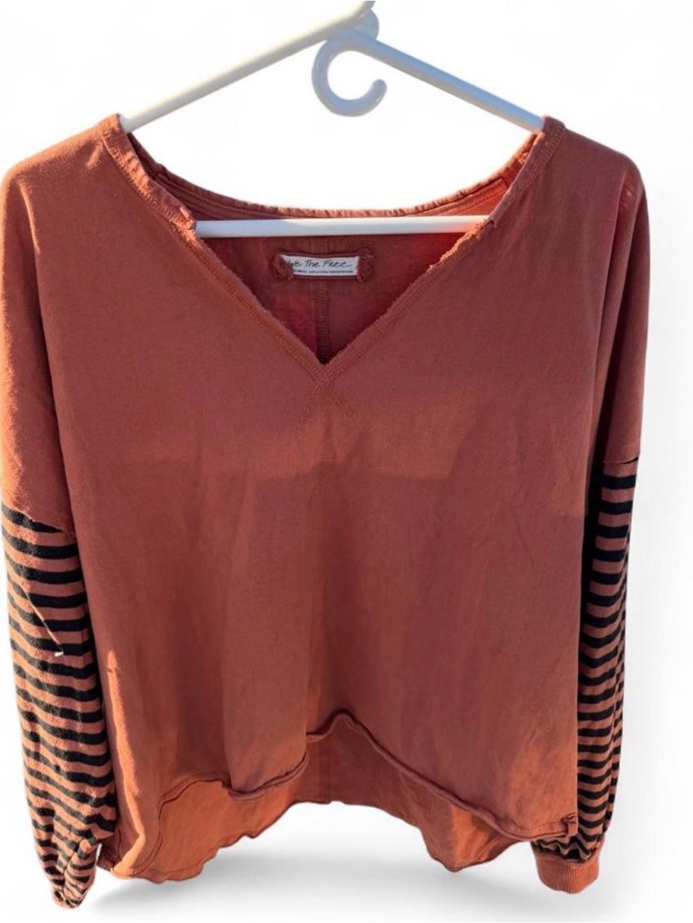 free the people’s women’s oversized Washed Rust V-Neck  Striped Sleeves